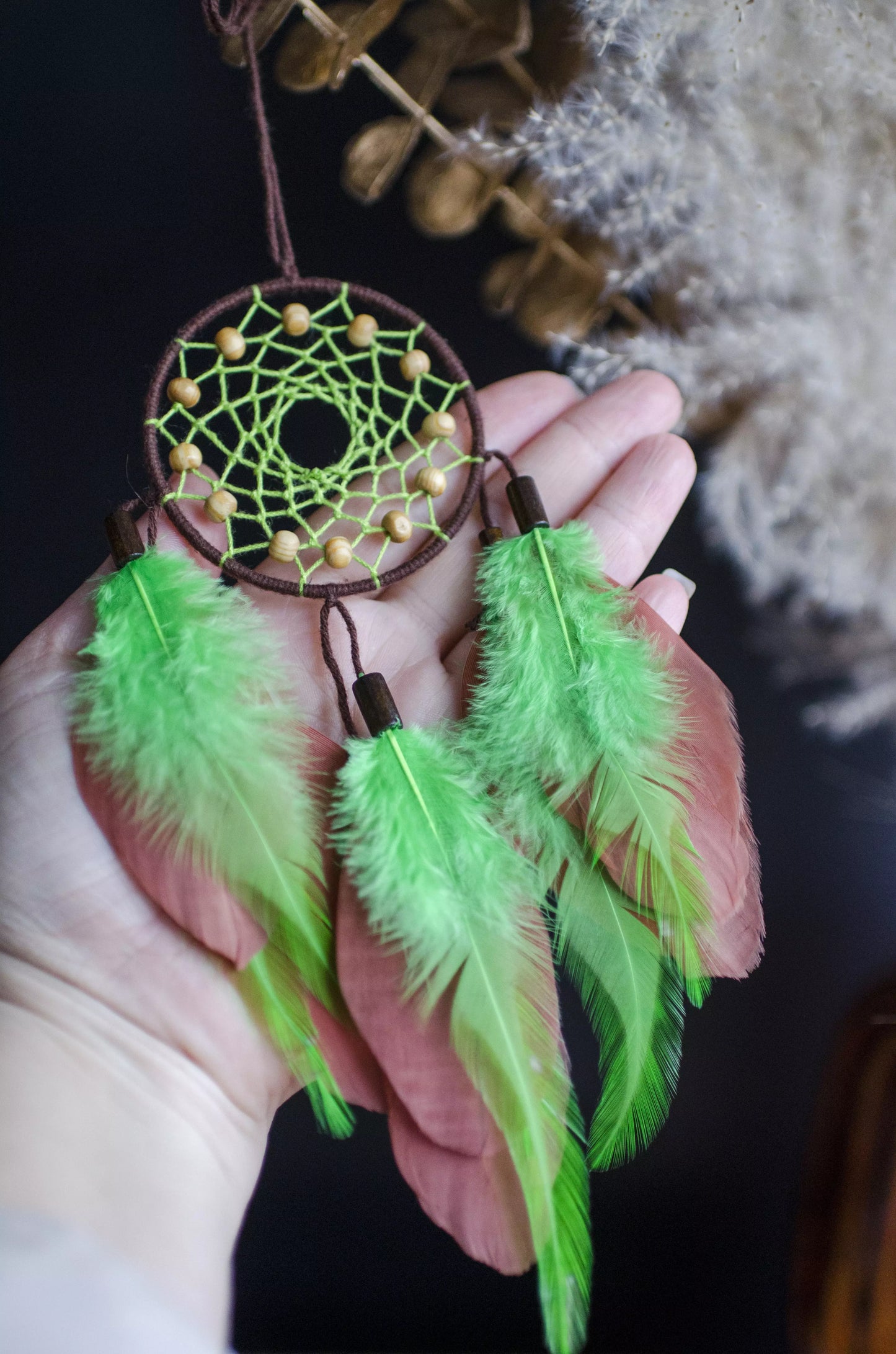 DIY dream catcher kit featuring a circular hoop with a woven web, soft feathers, and bead accents—ideal for beginners. Includes a digital tutorial with step-by-step video instructions to create your own handmade boho dreamcatcher.