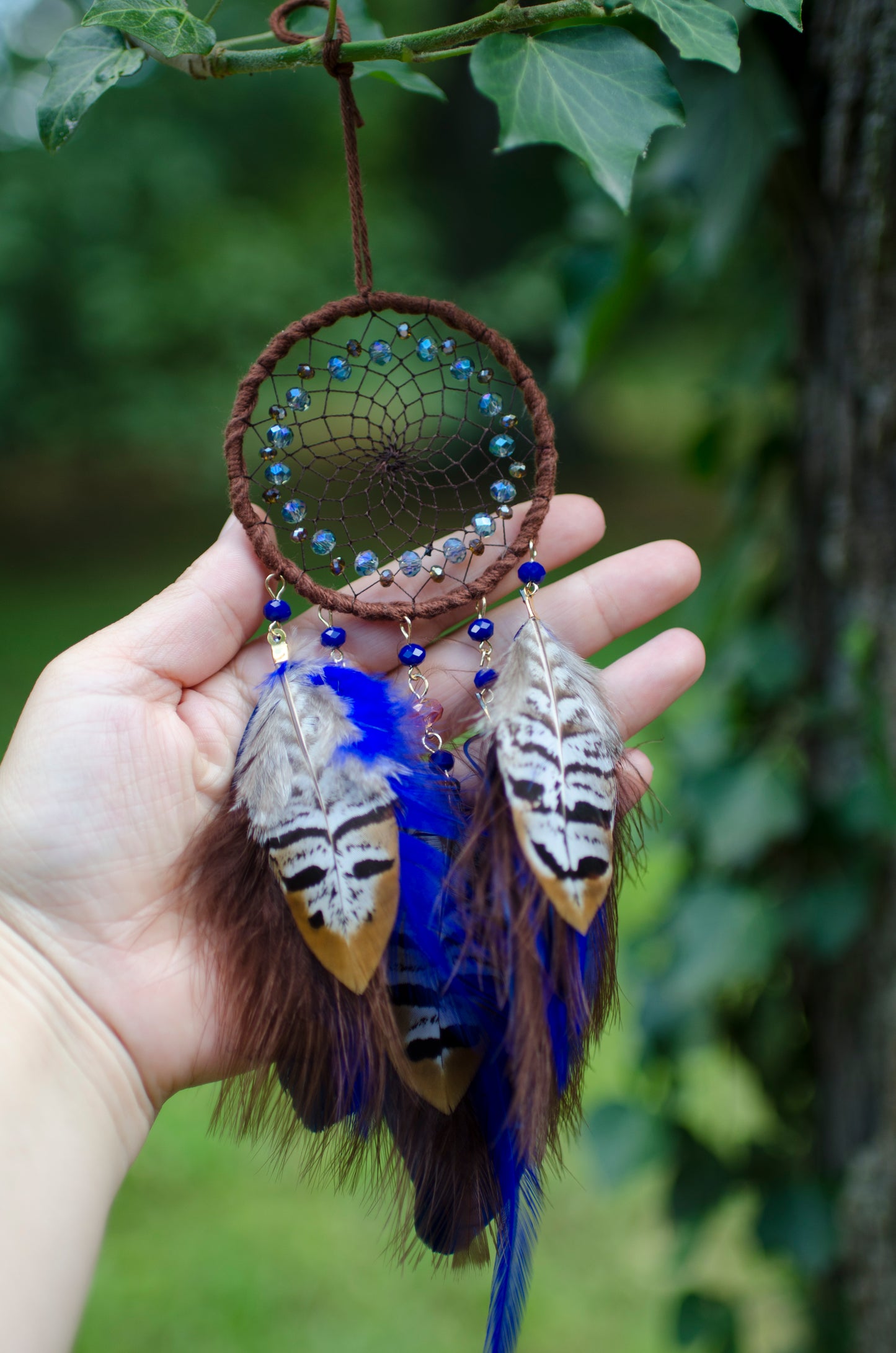 Small dreamcatcher with brown and blue feathers - car rearview mirror size