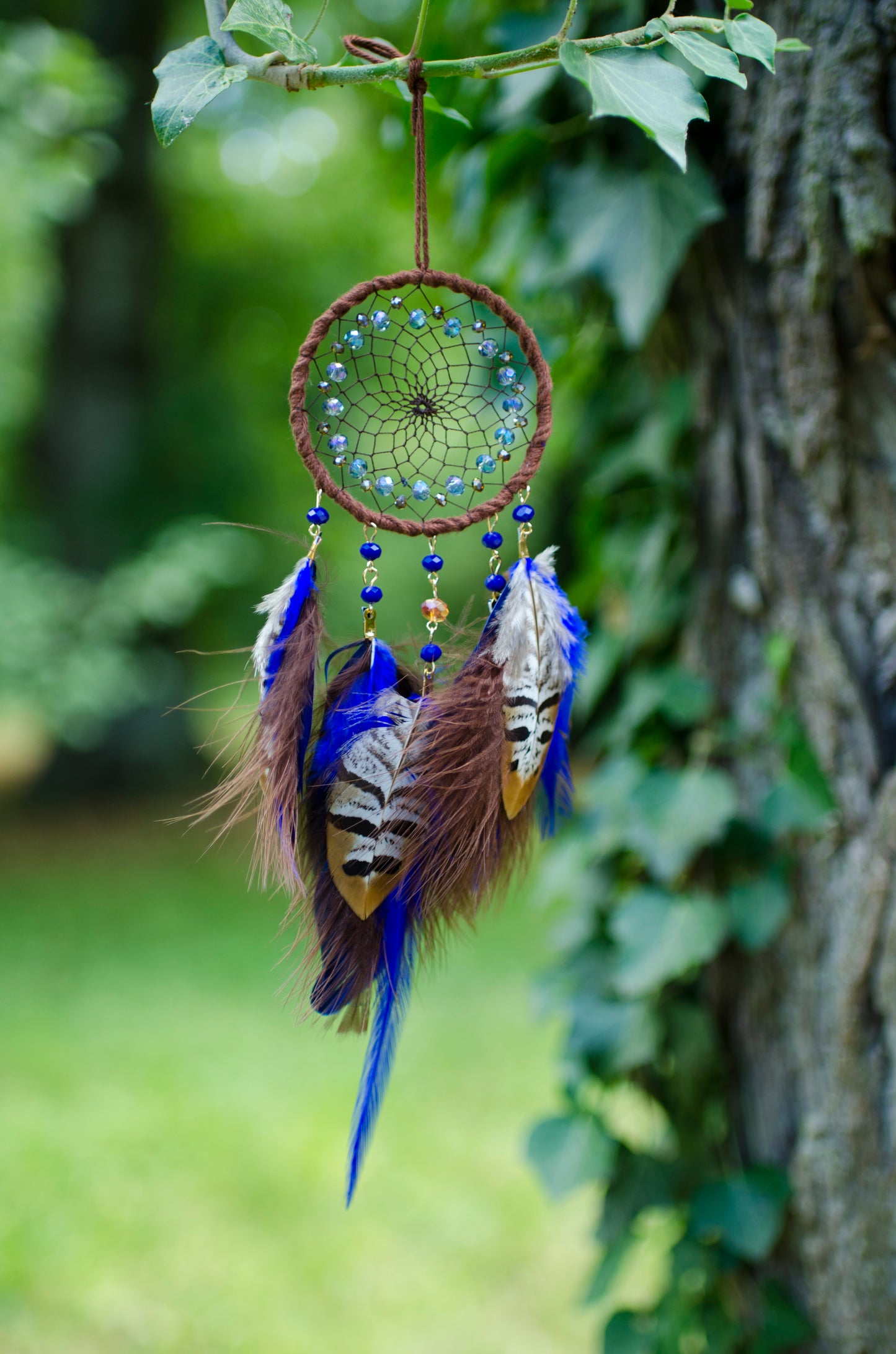 Small dreamcatcher with brown and blue feathers - car rearview mirror size