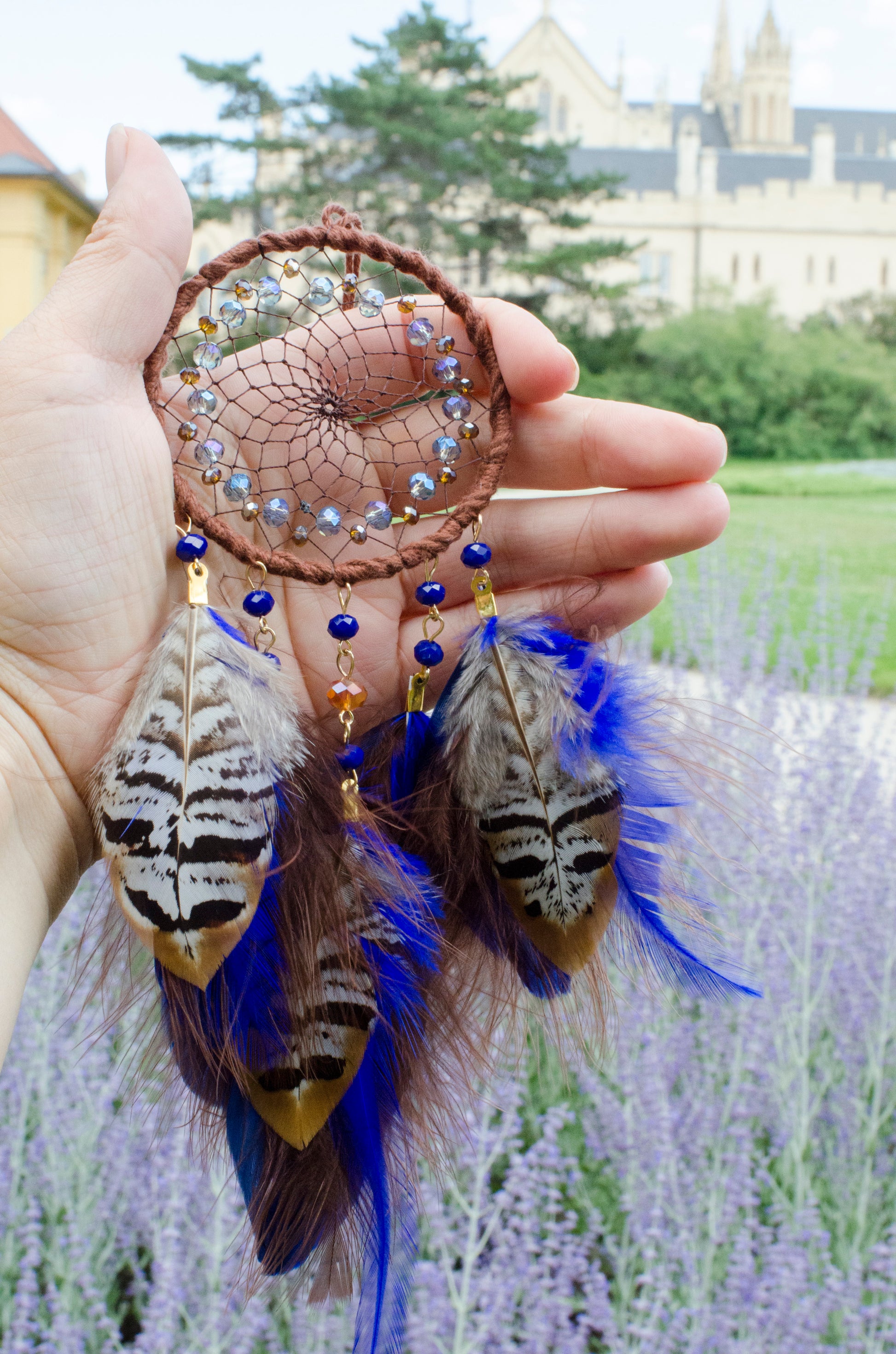 Small dreamcatcher with brown and blue feathers - car rearview mirror size