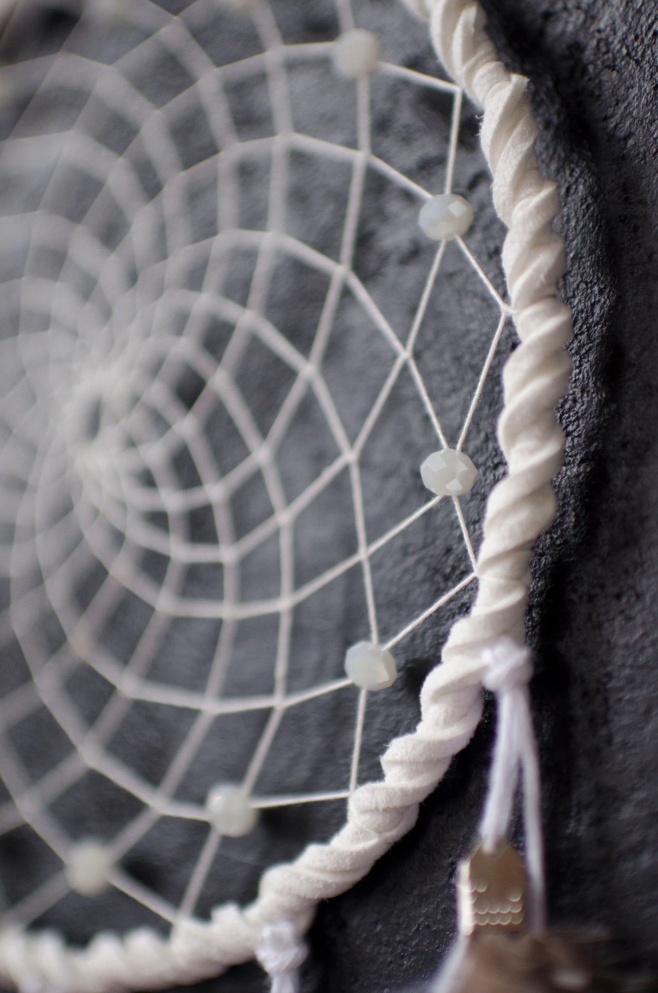 Traditional dreamcatcher with natural white feathers