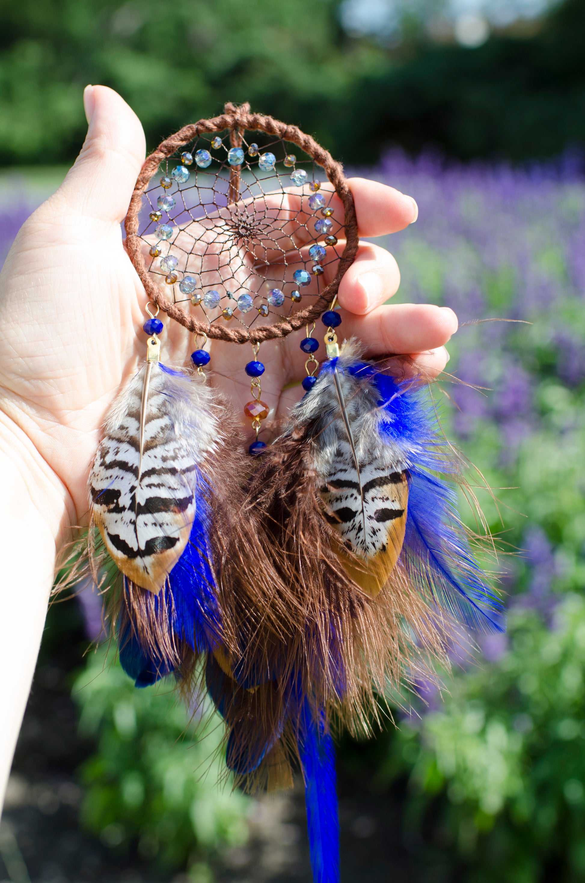 Small dreamcatcher with brown and blue feathers - car rearview mirror size