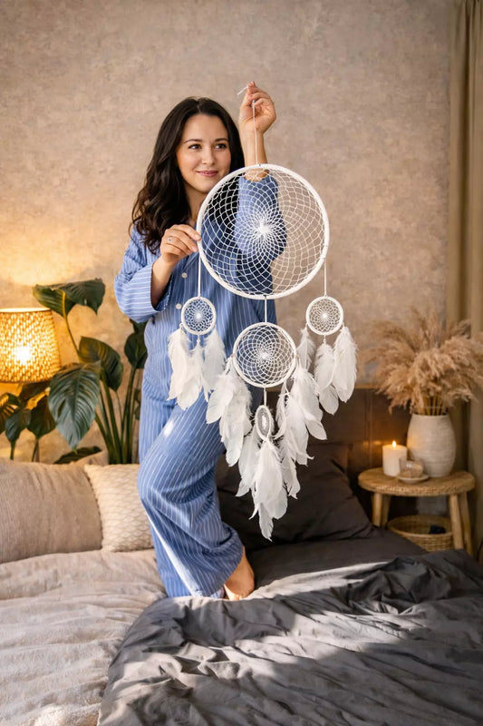 Handmade dreamcatcher with intricate web design, available in white or black, featuring hanging elements and two size options—standard and XL—perfect for boho or spiritual home decor.