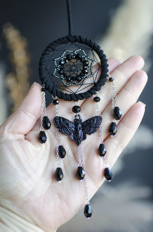 Mini black handmade dreamcatcher with beaded web, silver chains, and a gothic charm featuring either a snake or moth, perfect for dark boho decor, spiritual protection, or witchy car and room ornament.
