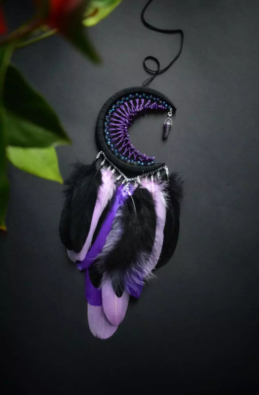 Handmade purple triple moon dreamcatcher set featuring intricate moon phase designs, adorned with purple and black feathers, amethyst crystal accents, and chain details. Perfect for celestial-inspired boho wall decor or spiritual meditation spaces.